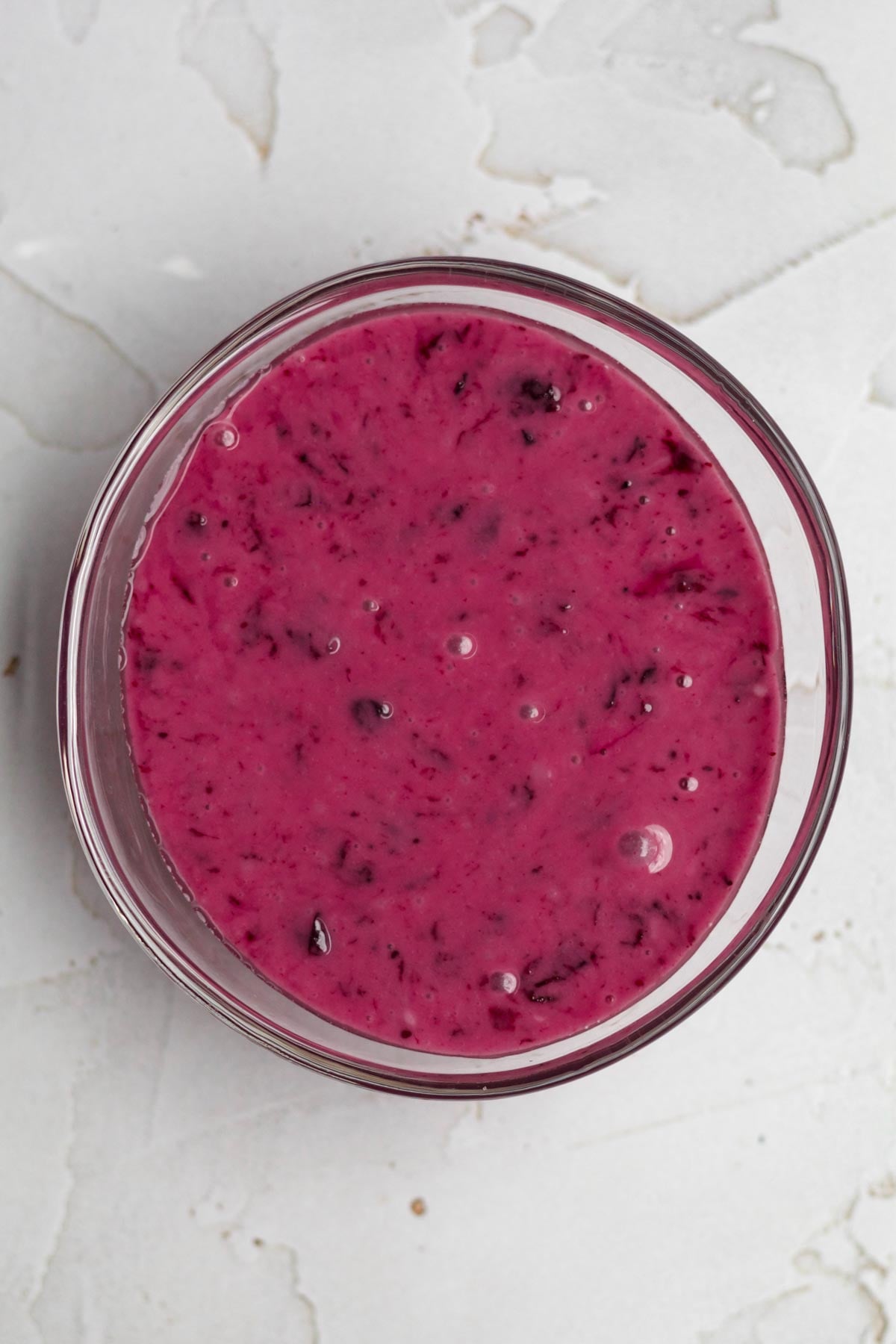 Sweet magenta blueberry icing in a bowl.