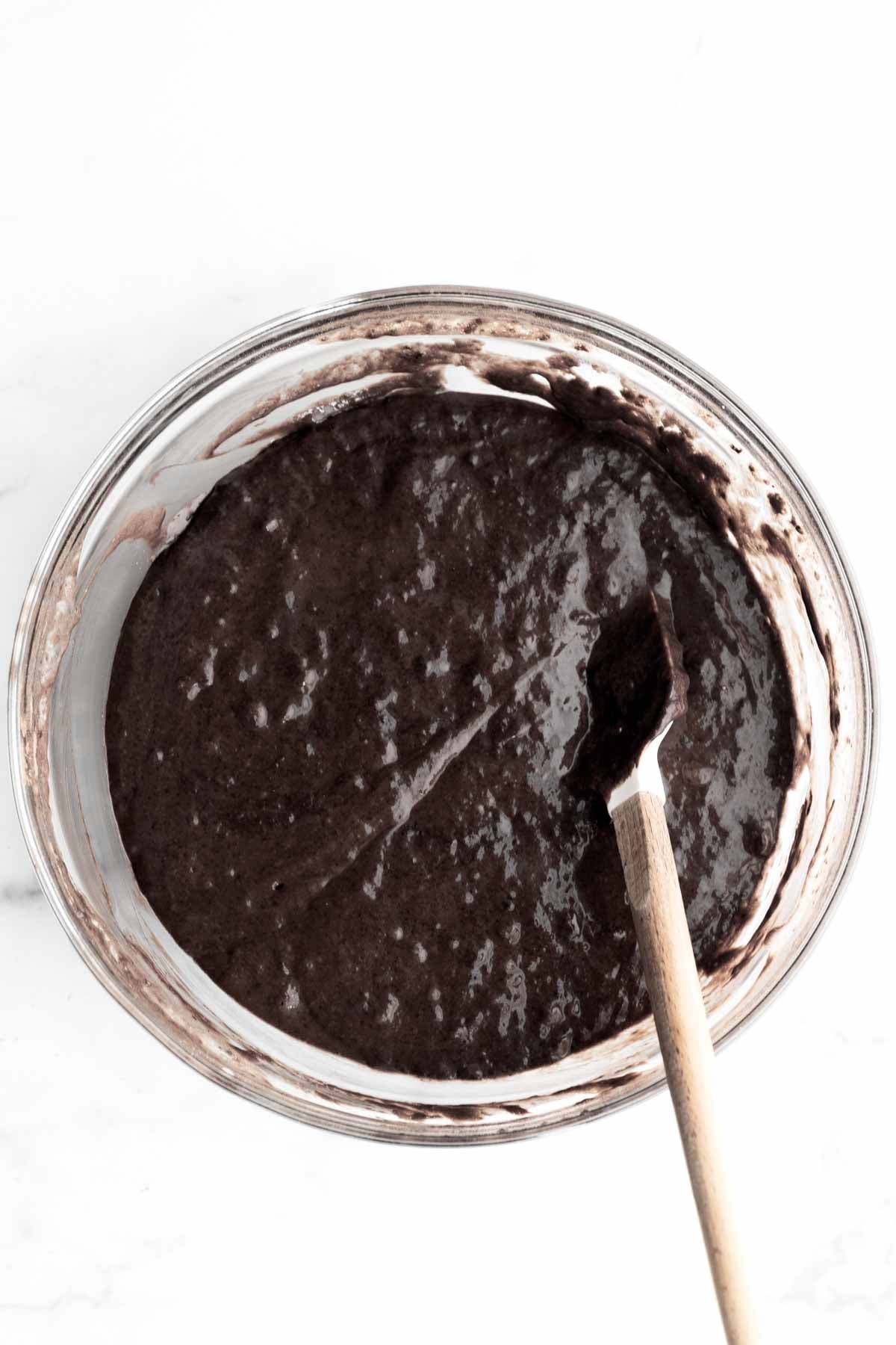 Mixing the wet and dry ingredients into the cupcake batter.