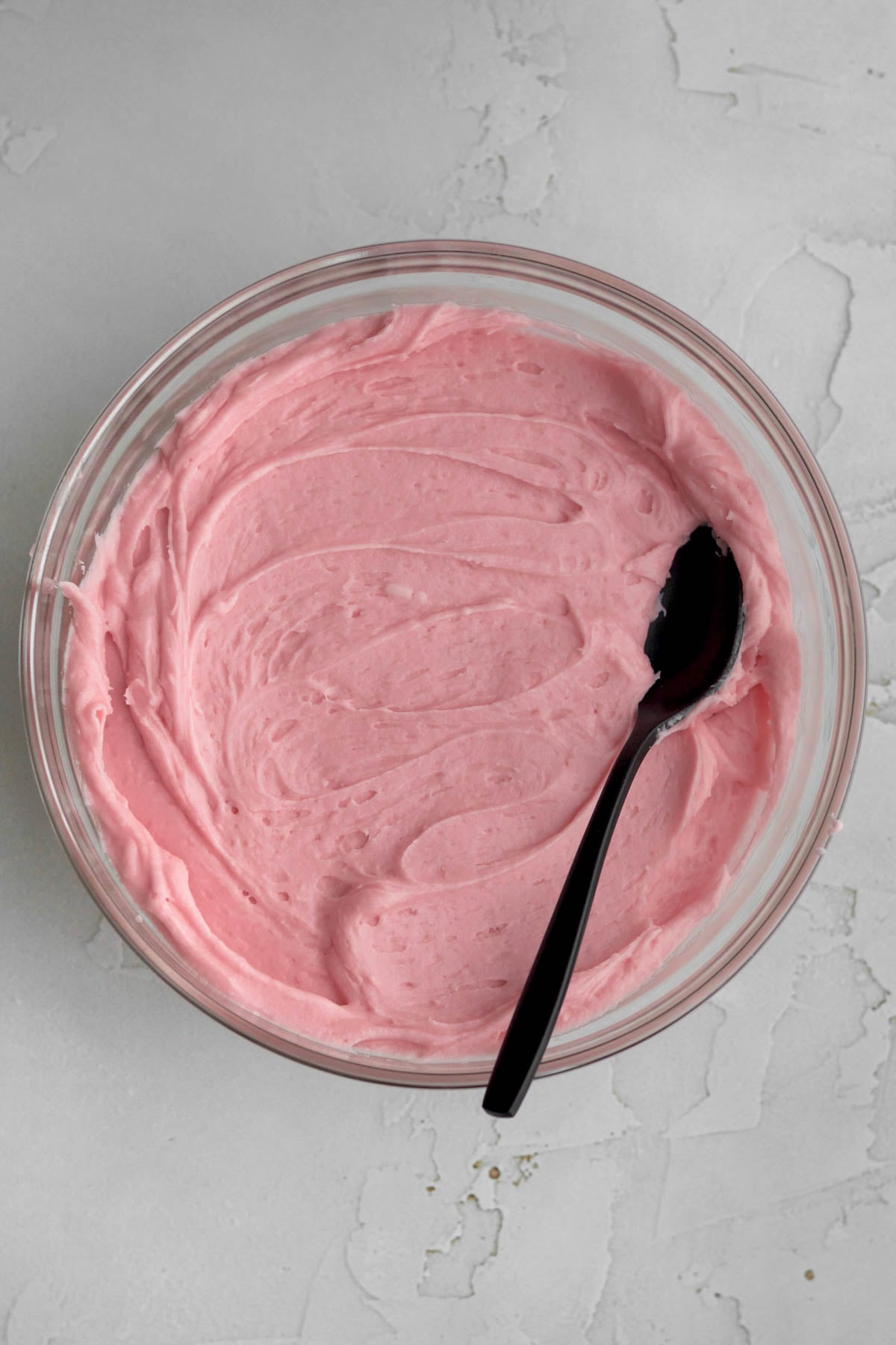 A bowl of raspberry buttercream.