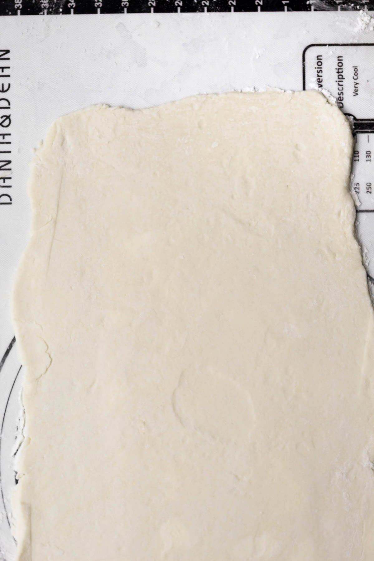 A flat rectangle of puff pastry dough.