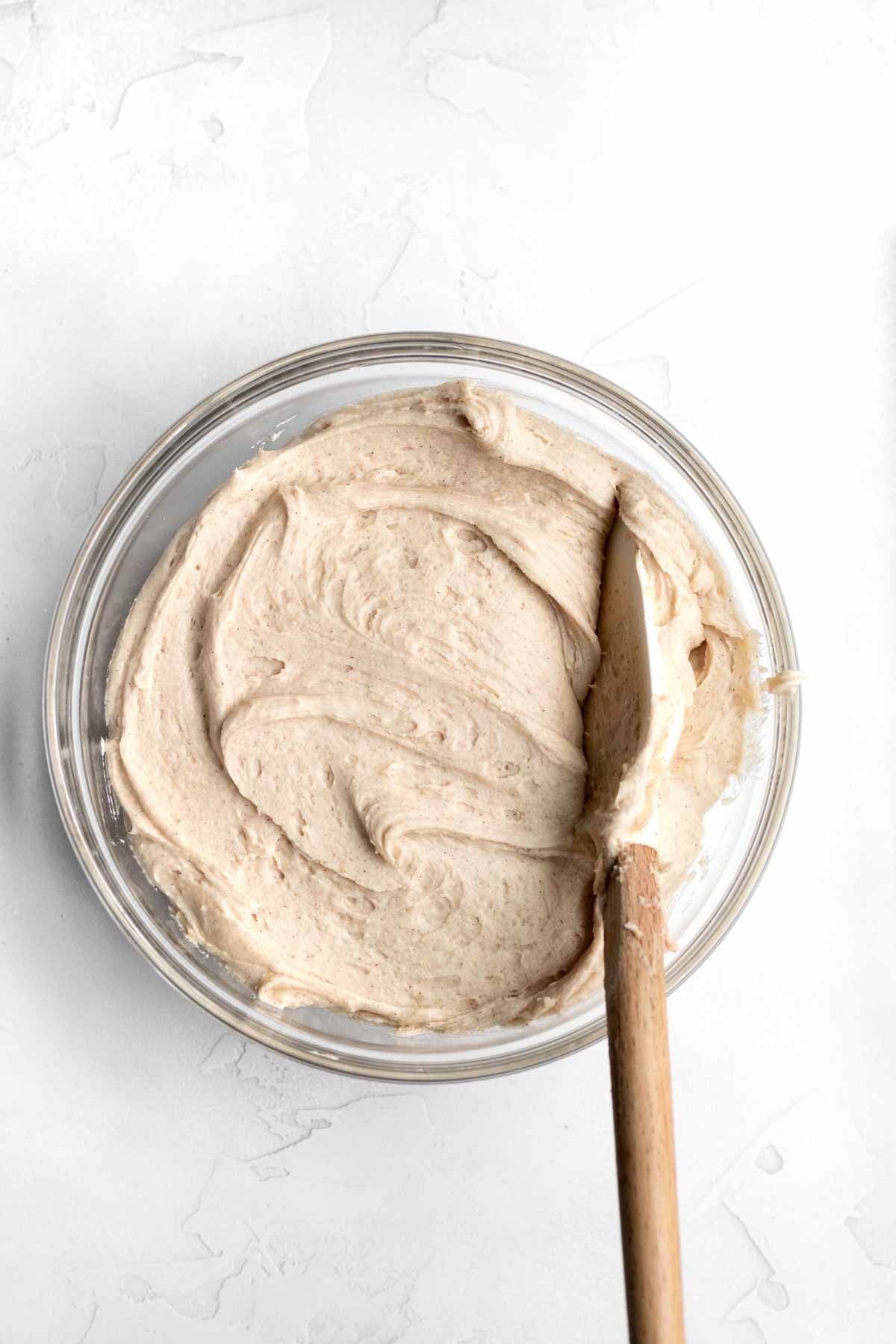 Creamy brown sugar frosting in a bowl.