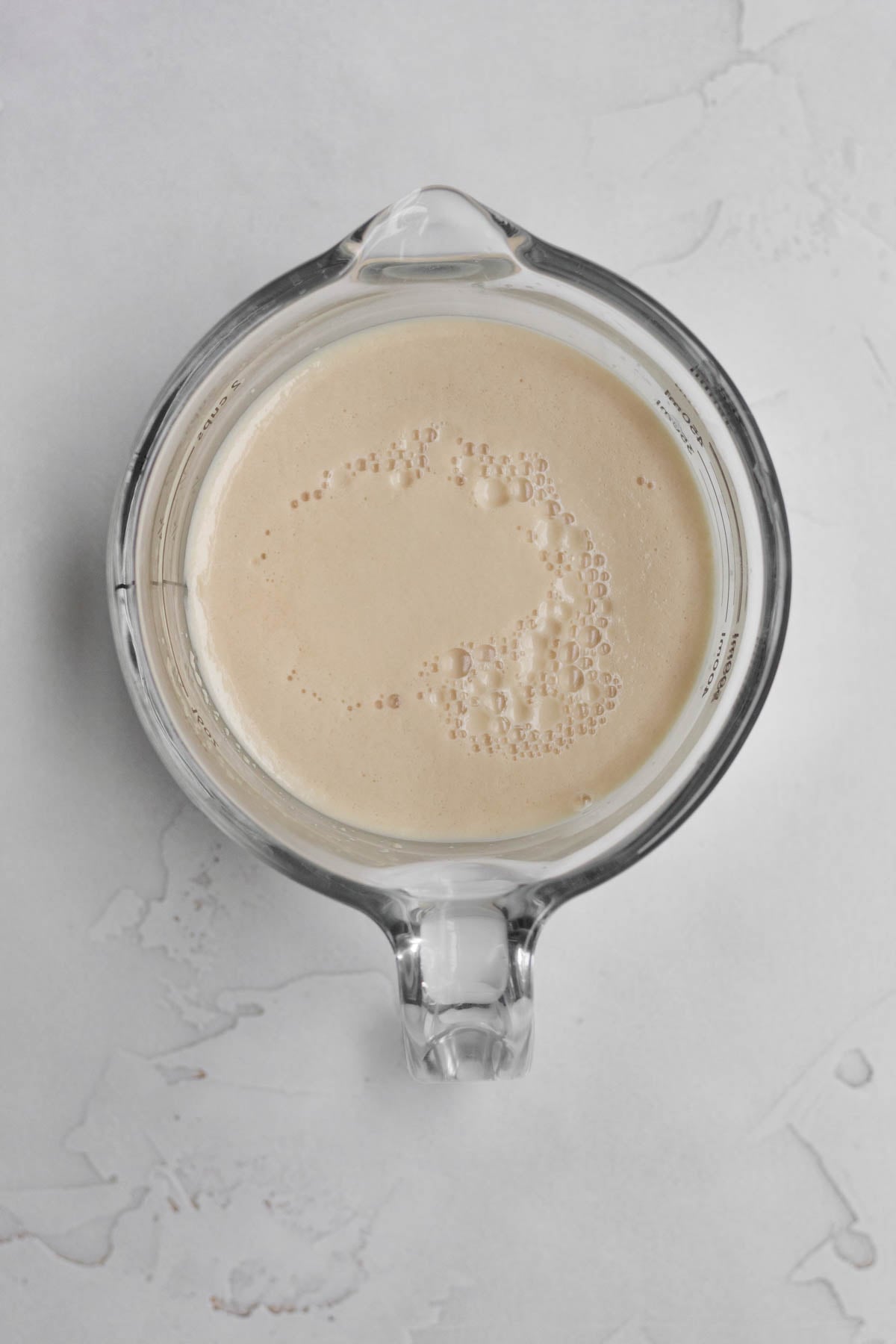 Yeast pluming up from the warm water.