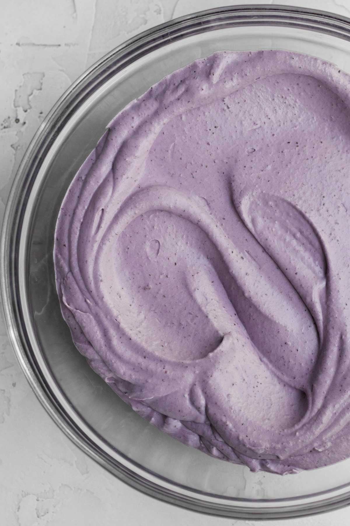 Mixing in the blueberry mixture to make the ice cream base.