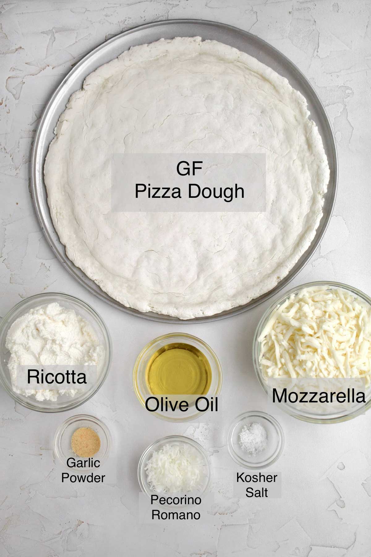 Pizza bianca (white pizza) ingredients listed separately: gluten free pizza dough, ricotta, olive oil, mozzarella, garlic powder, pecorino romano and kosher salt.