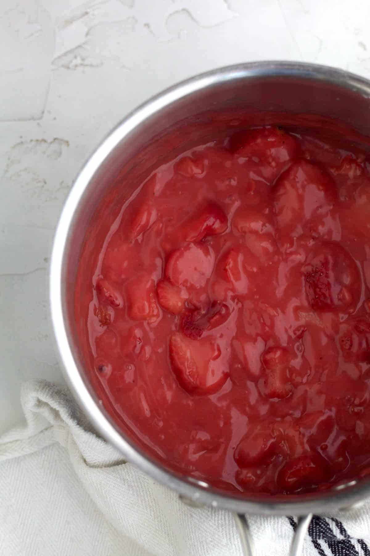 Adding heat, bright strawberries and butter to the mix.