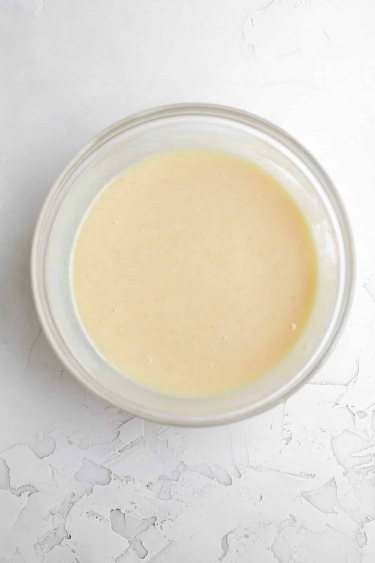 The peach syrup mixed with sweetened condensed milk and vanilla.
