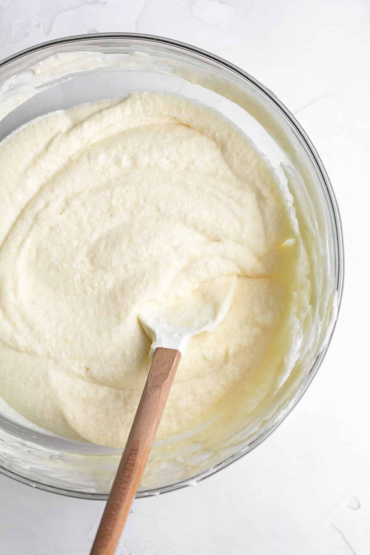 Mixing in the heavy cream into the mixture.