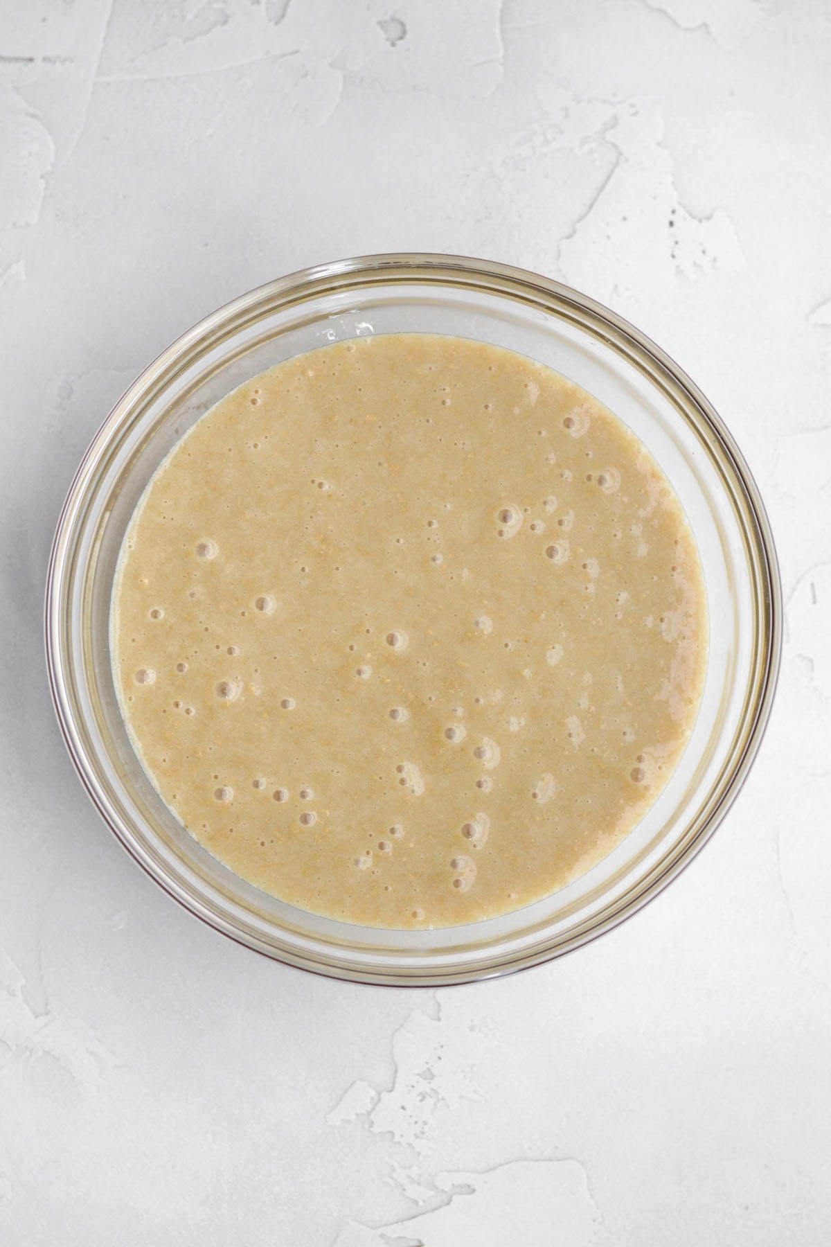 A tan mixture of graham cracker crumbs and sweetened condensed milk.