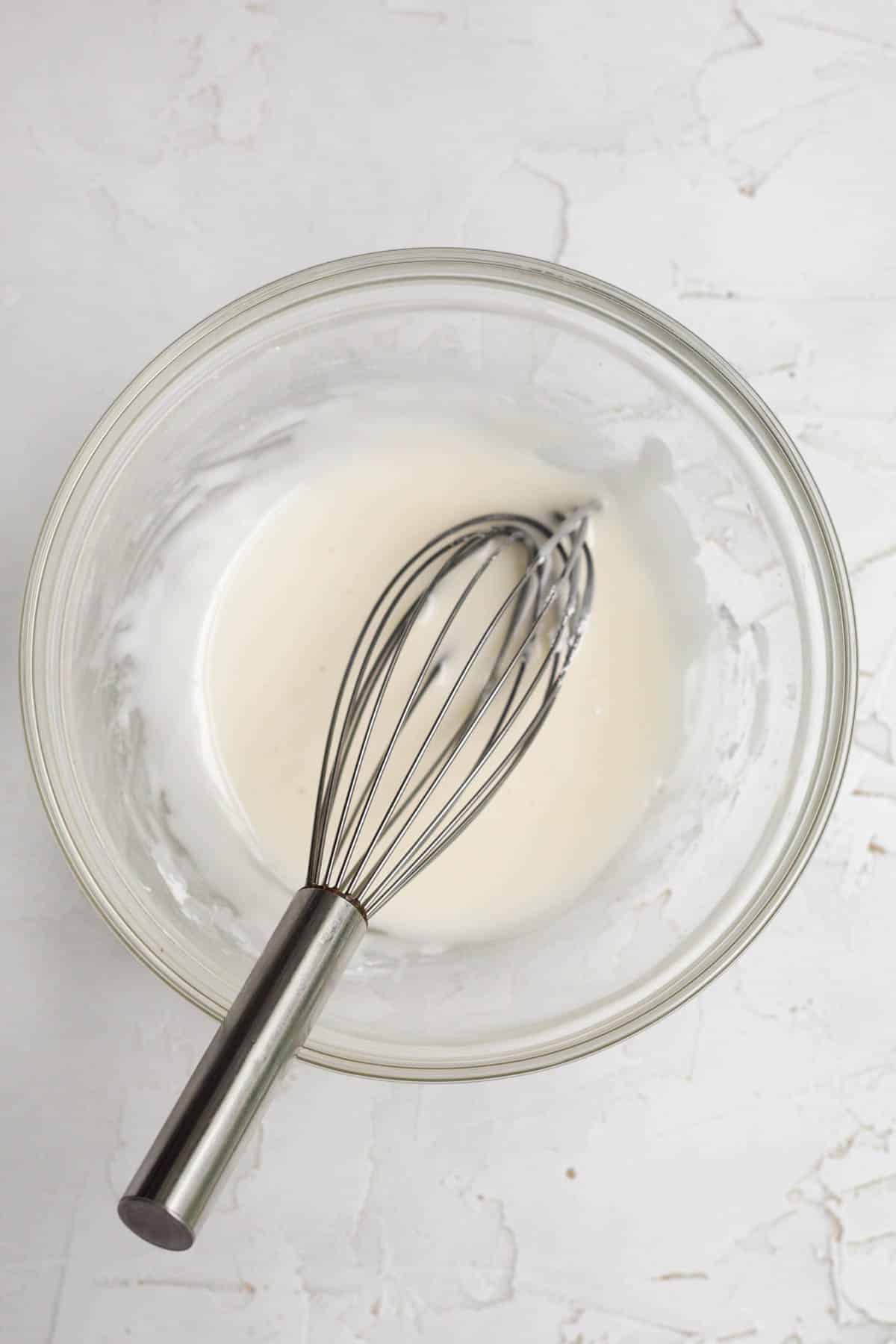 A whisk with the apple glaze.