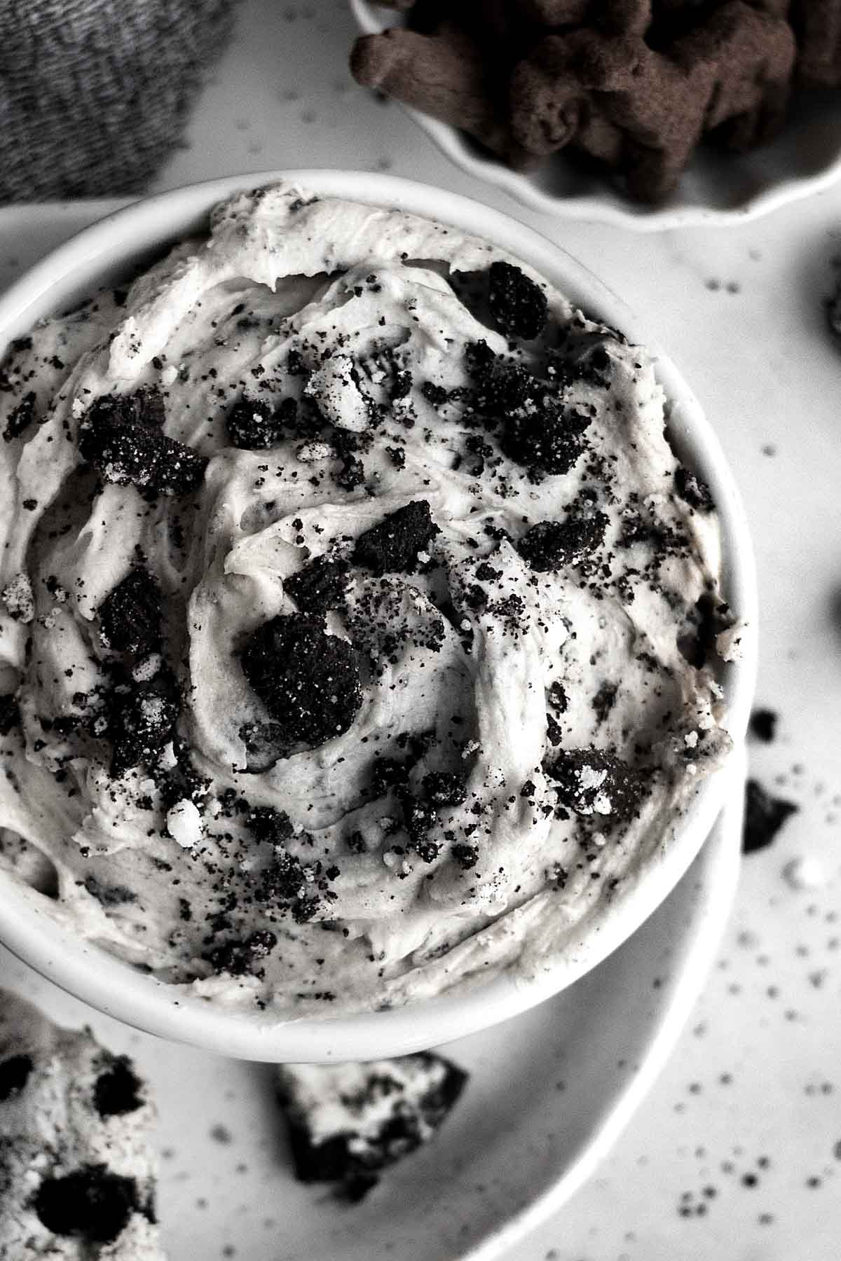 Creamy and sweet Oreo dip in a white bowl.