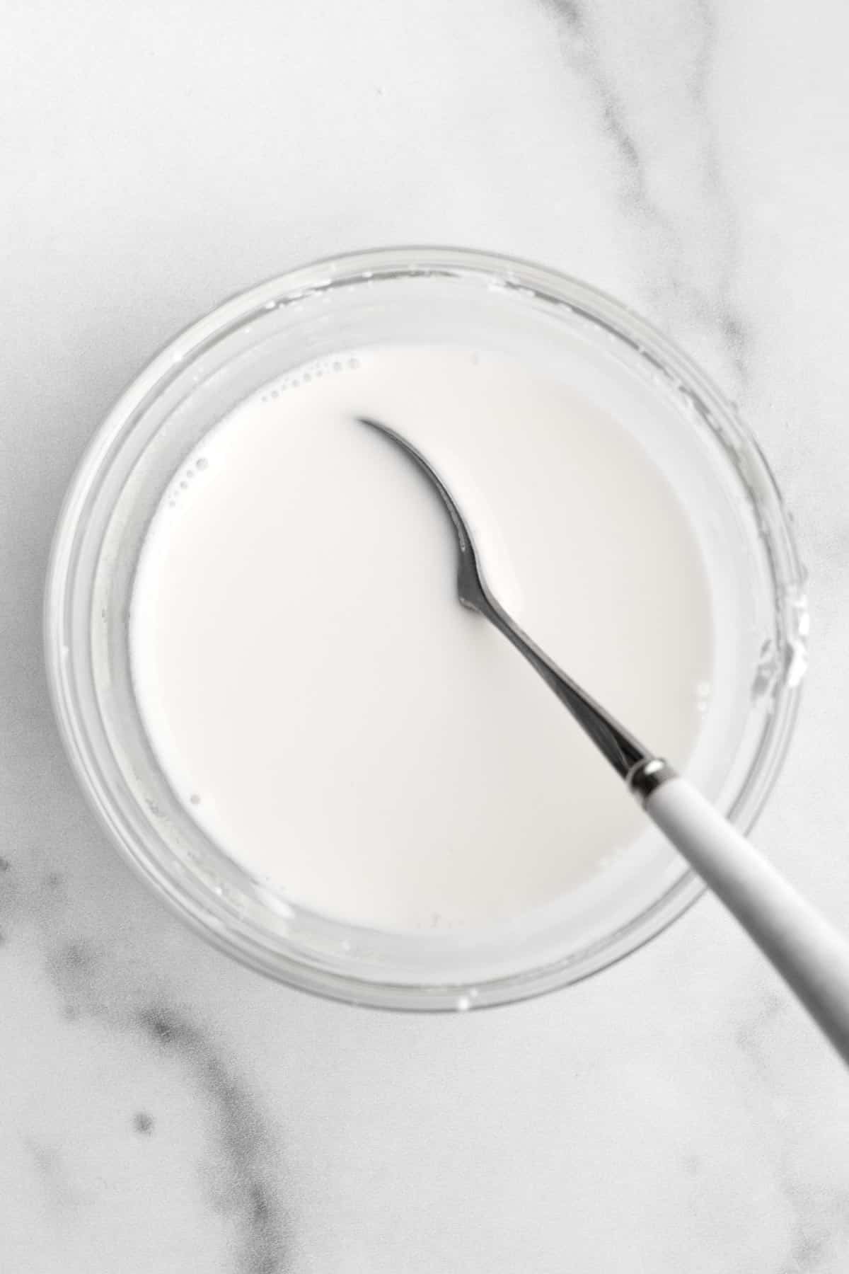 Milky white cornstarch water in a bowl.