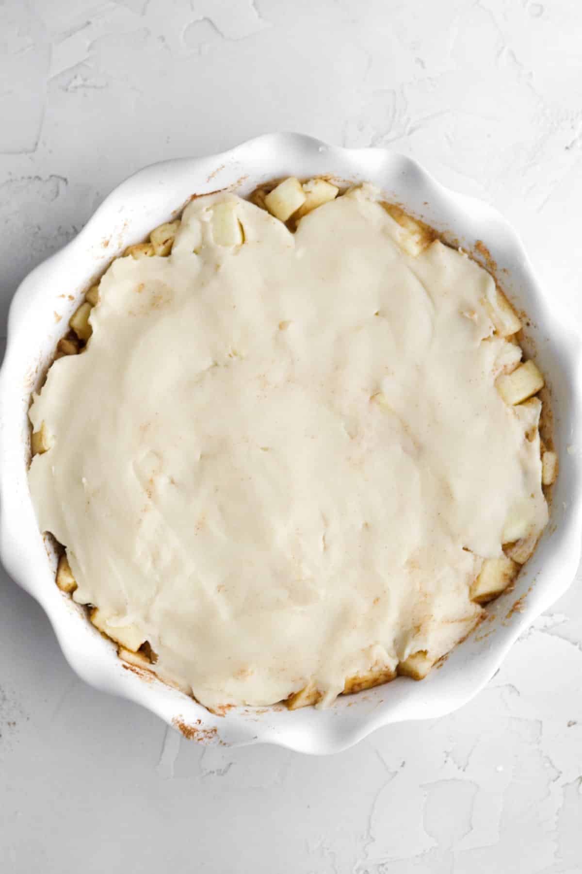 Spreading the dough balls flat to make the crust.