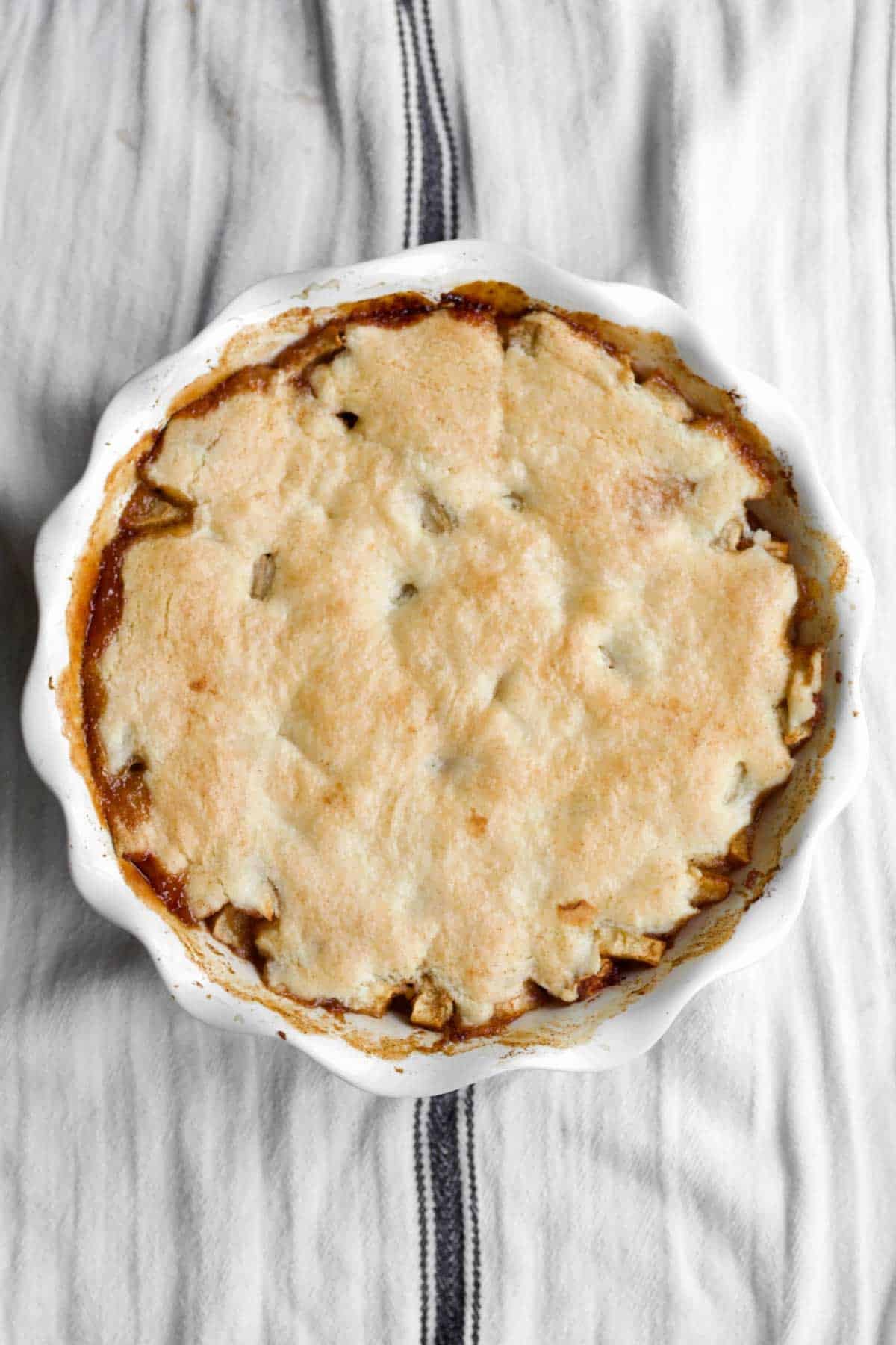 Fresh-baked, golden-brown gluten free apple cobbler right out of the oven.